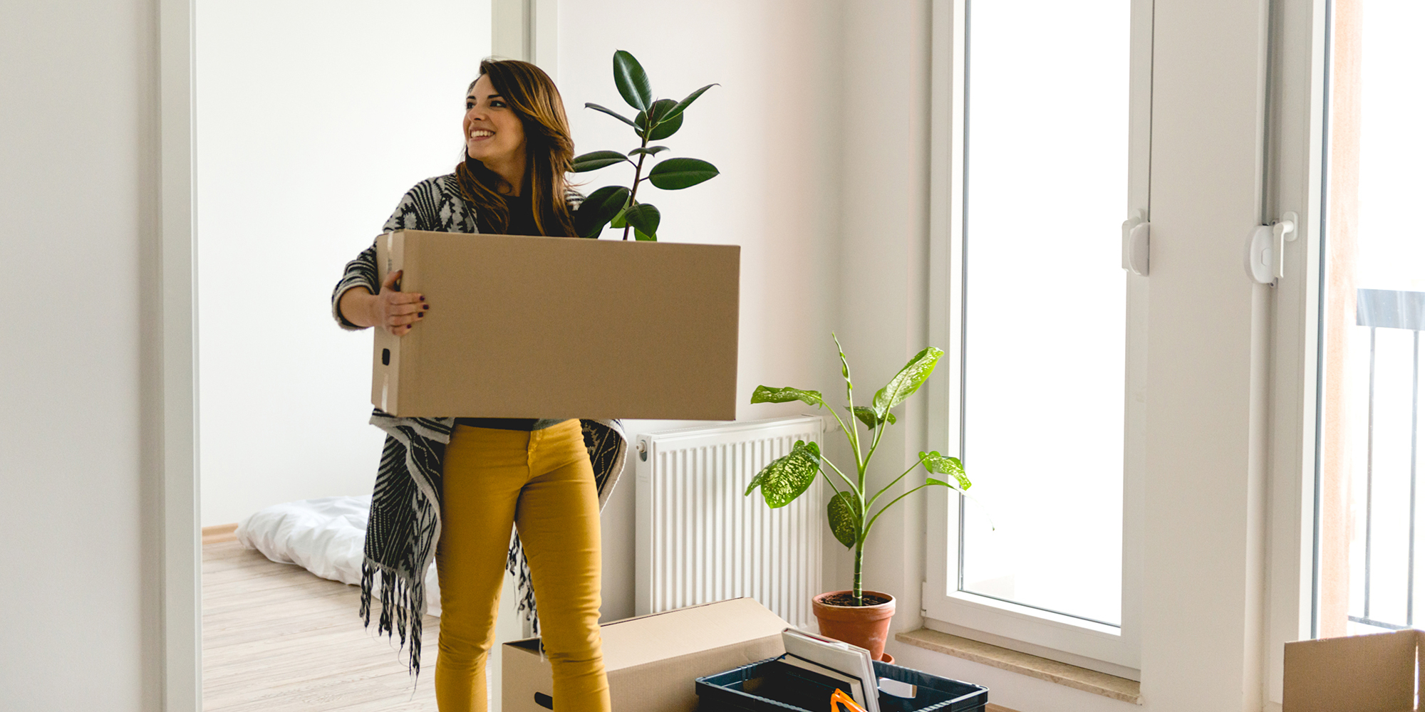 young woman moving into a new apartment