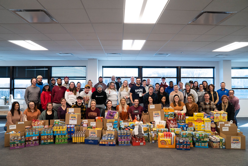 Uniti Med team with food pantry donations.