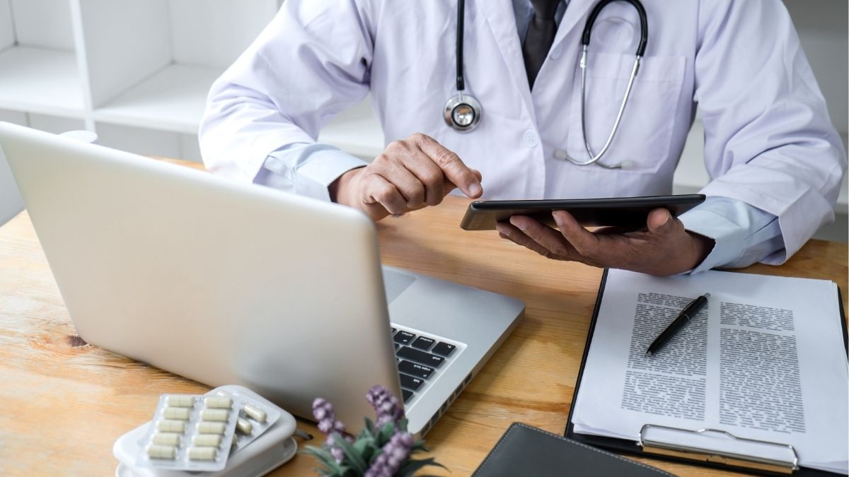 Doctor using laptop